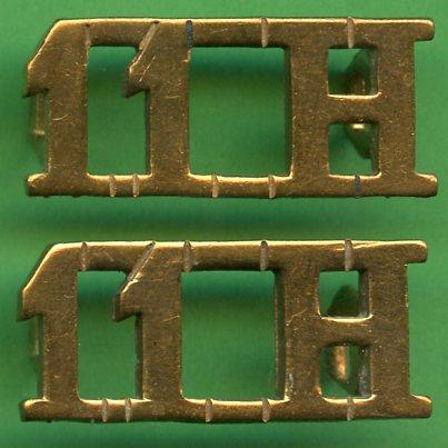 Pair of 11th Hussars Shoulder Title Badges